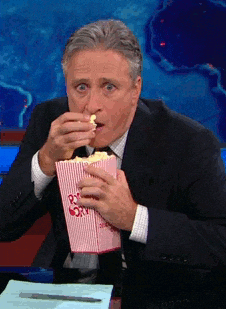 Jon Stewart Eating Popcorn — Reaction meme