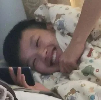 Boy Laughing at Phone — Reaction meme