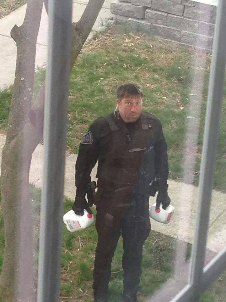 Cop with gallon milk jugs — Reaction meme