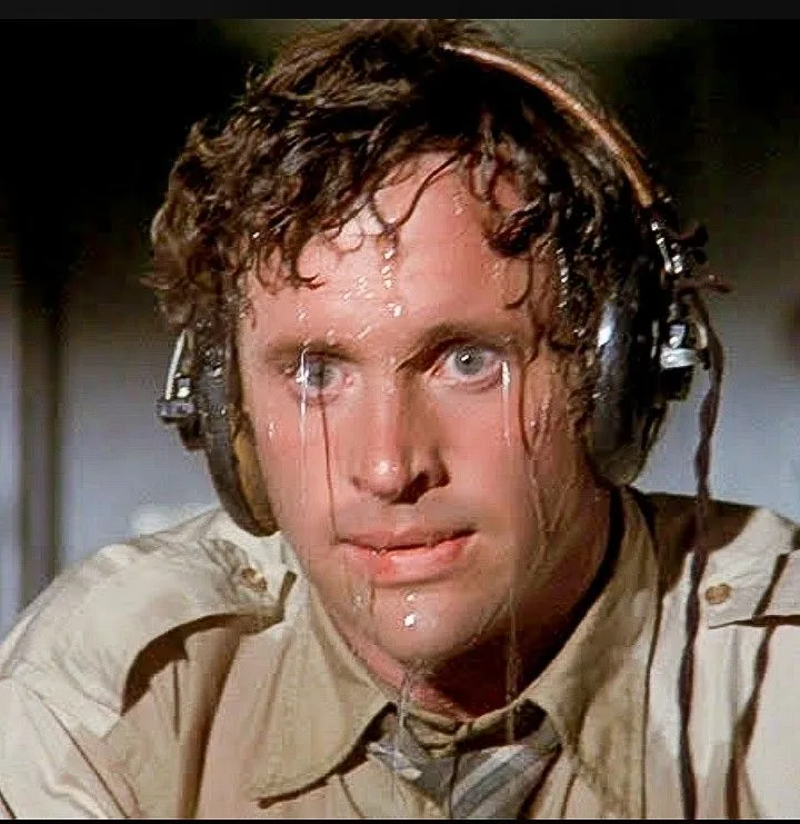 Guy sweating with headphones — Reaction meme